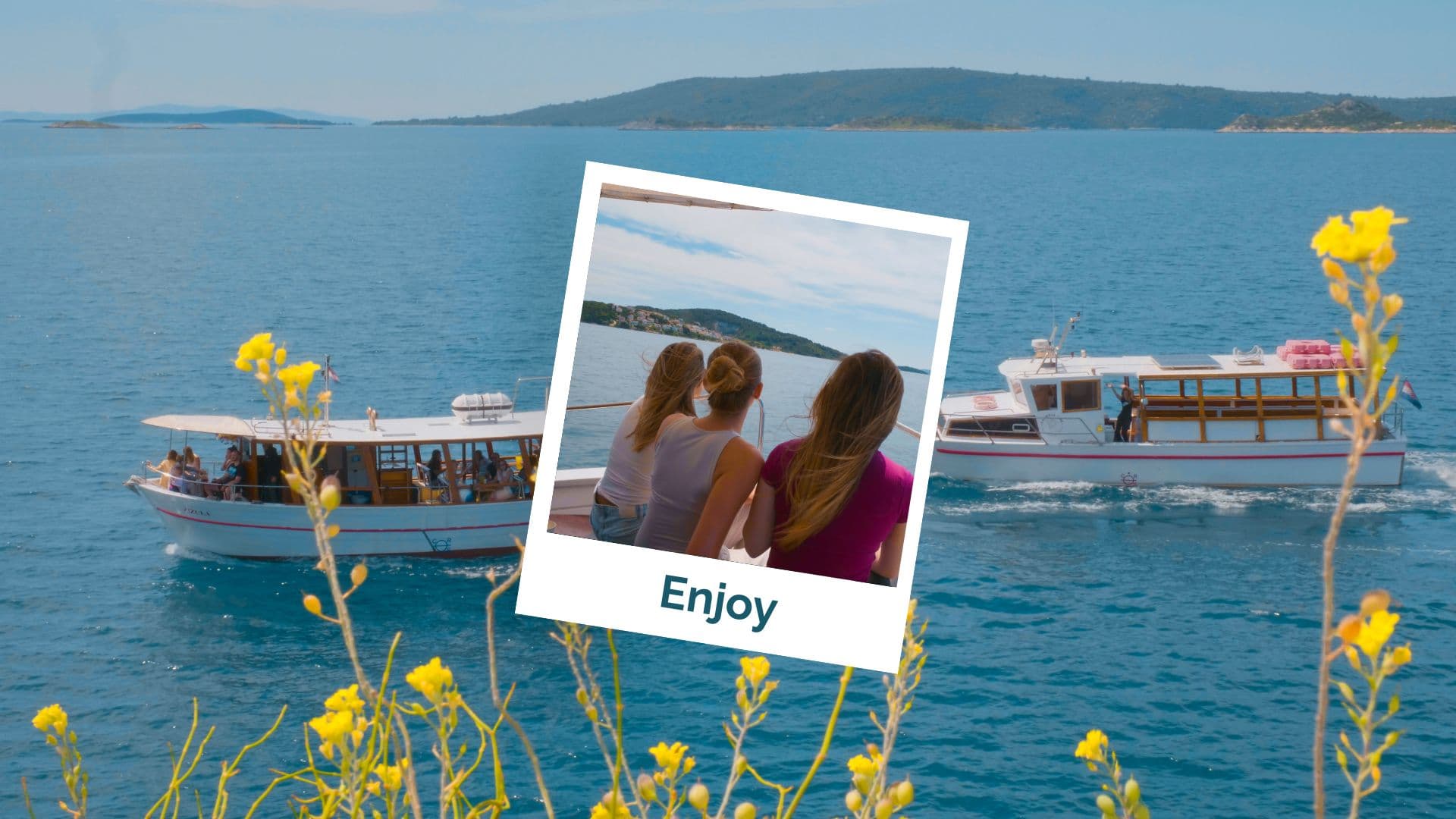 Guests swimming in a calm, crystal-clear cove