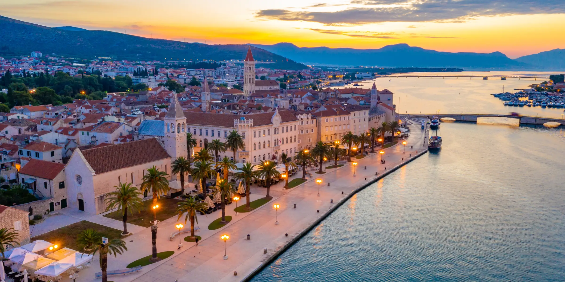 Rose and navy sunset over the Trogir, seen from the water